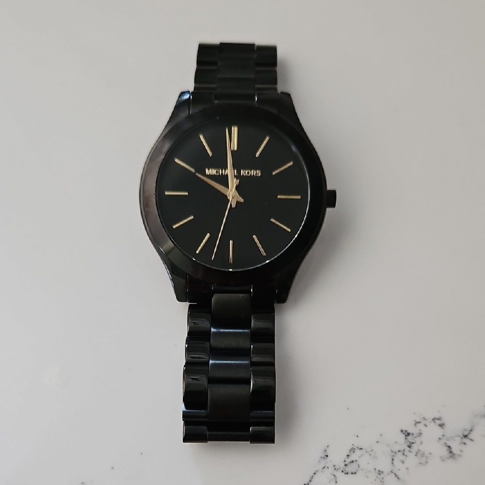 Michael Kors Sleek Black and Gold Timepiece